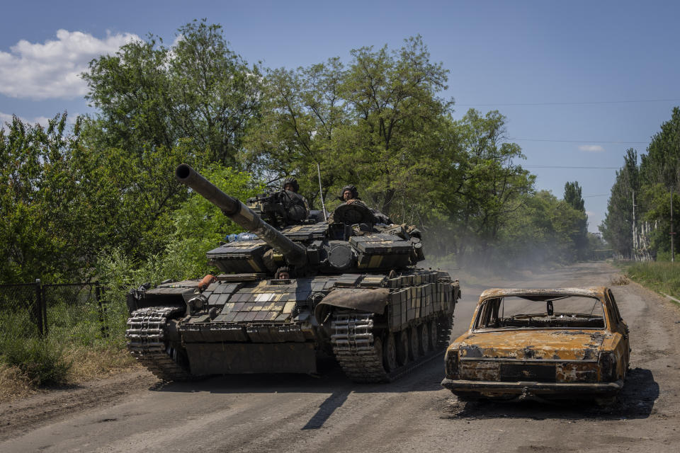 Ukrainian servicemen drive a tank near the frontline in Donetsk region, eastern Ukraine, Monday, June 6, 2022. (AP Photo/Bernat Armangue)