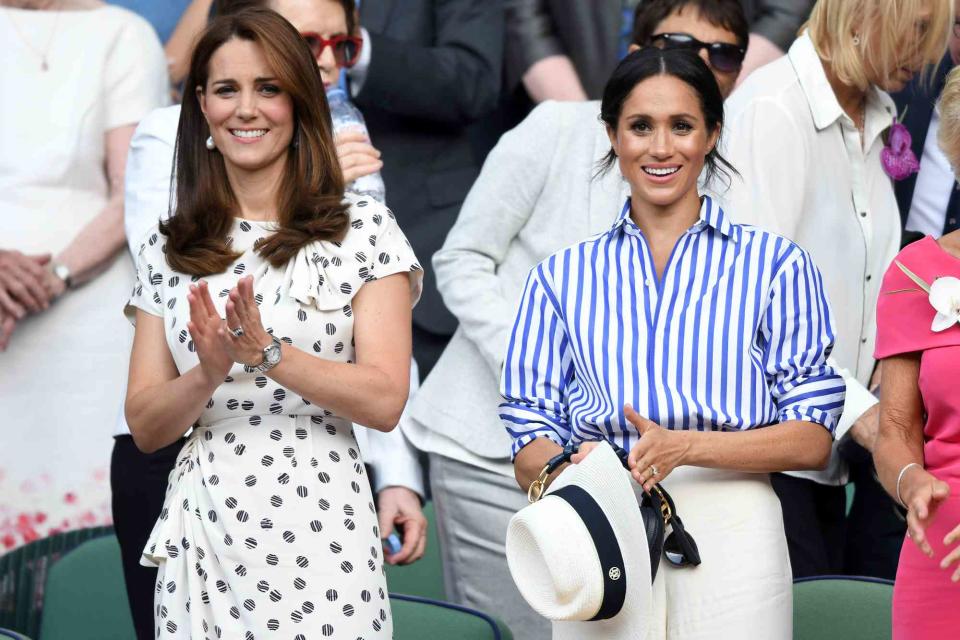 <p>Karwai Tang/WireImage</p> Kate Middleton and Meghan Markle attend Wimbledon 2018