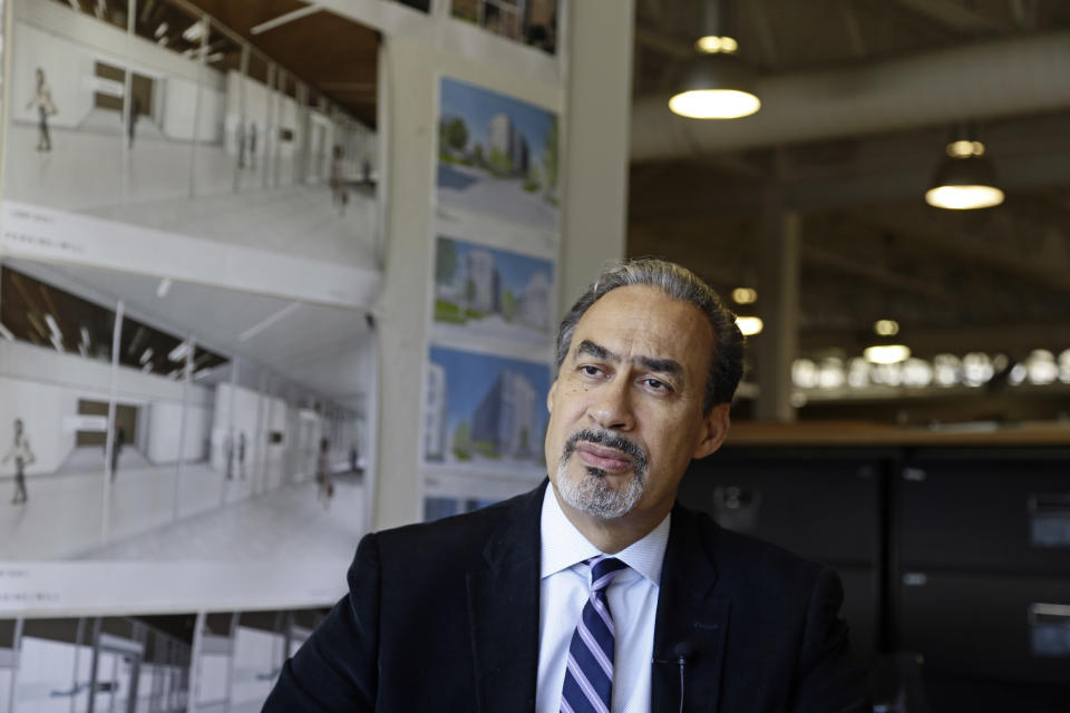 FILE - In this Jan. 18, 2017, photo, architect Phil Freelon responds to a question during an interview at his office in Durham, N.C. Freelon, the architect of the National Museum of African American History and Culture and other libraries, museums and schools, died Tuesday, July 9, 2019. Freelon was 66 years old and had suffered from ALS for several years. (AP Photo/Gerry Broome, File)