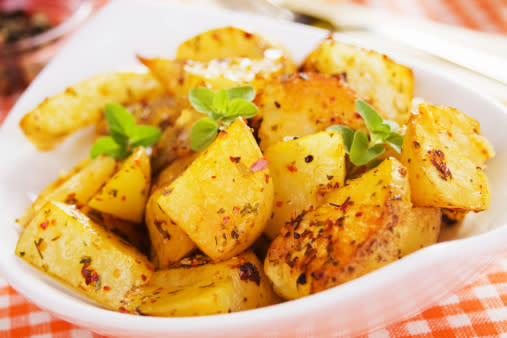 Roasted potato in white bowl