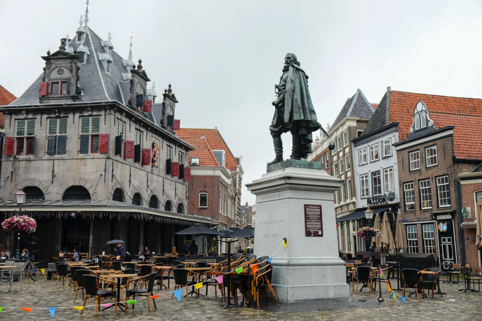 In this Thursday, June 11, 2020, file image, A statue of the Dutch Golden Age trader and brutal colonialist Jan Pieterszoon Coen stands tall above a square in his hometown of Hoorn, north of Amsterdam, Netherlands. Coen was a leading figure in 17th-century trading powerhouse the Dutch East India Company, but has gone down in history as the "butcher of Banda," the man who ordered a bloody massacre on the Banda Islands, Indonesia. Activists spurred by the Black Lives Matter protests in the United States are seeking to shed more light on the Dutch colonial past and tackle what they call ingrained racism and discrimination in this nation that was once known as a beacon of tolerance. (AP Photo/Michael Corder, File)