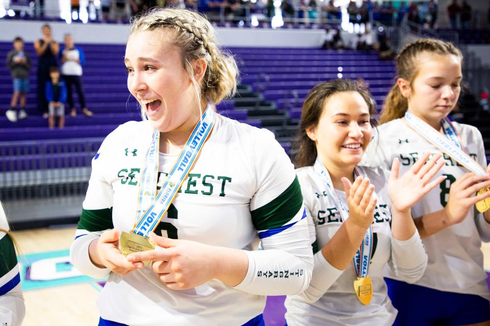 Seacrest Country Day School's Breanah Rives (6) receives a gold medal after the team wins the Class 2A State Championship volleyball match between Seacrest Country Day and Lake Worth Christian on Wednesday, Nov. 17, 2021 at the Suncoast Credit Union Arena in Fort Myers, Fla. 