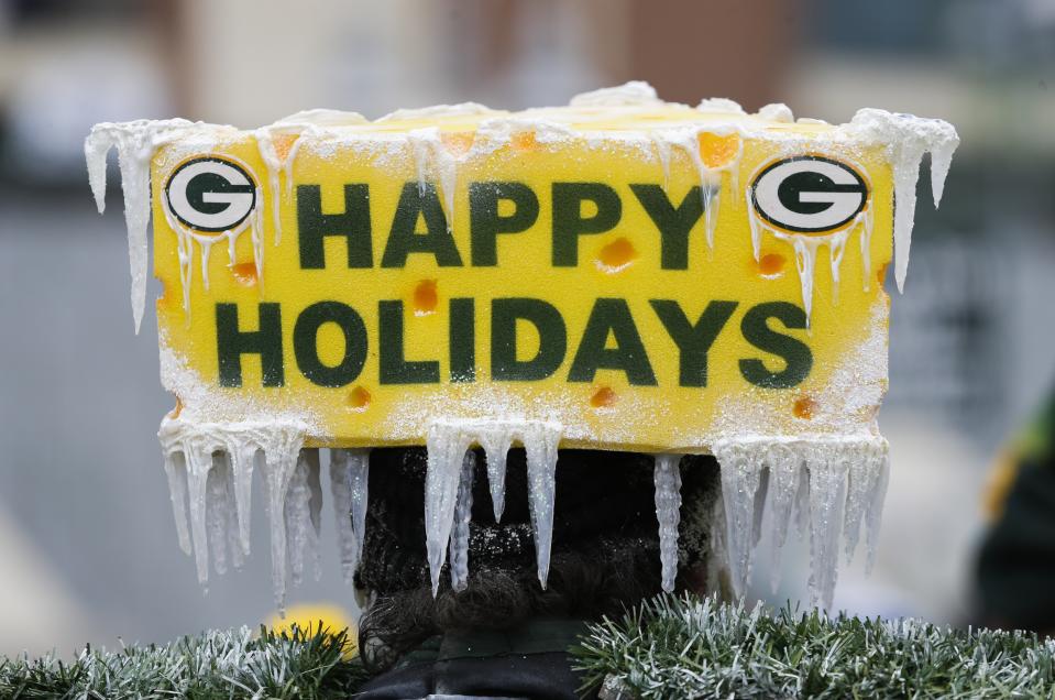 CORRECTS TO REMOVE SCORE- Fans tailgate before an NFL football game between the Green Bay Packers and the Detroit Lions Sunday, Dec. 30, 2018, in Green Bay, Wis. (AP Photo/Mike Roemer)