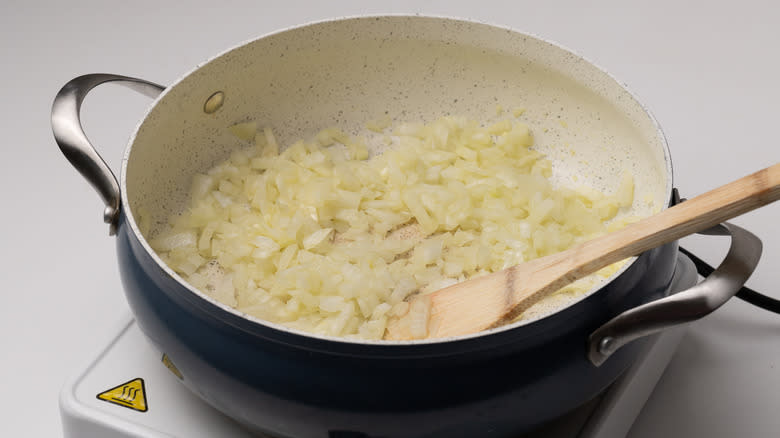 onions sauteing in a pan