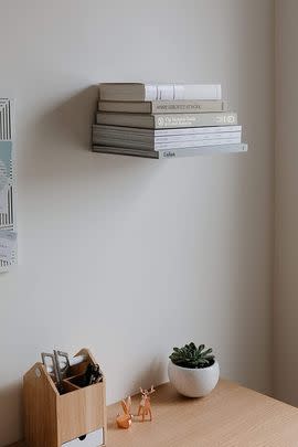 Use floating bookshelves to free up shelf space