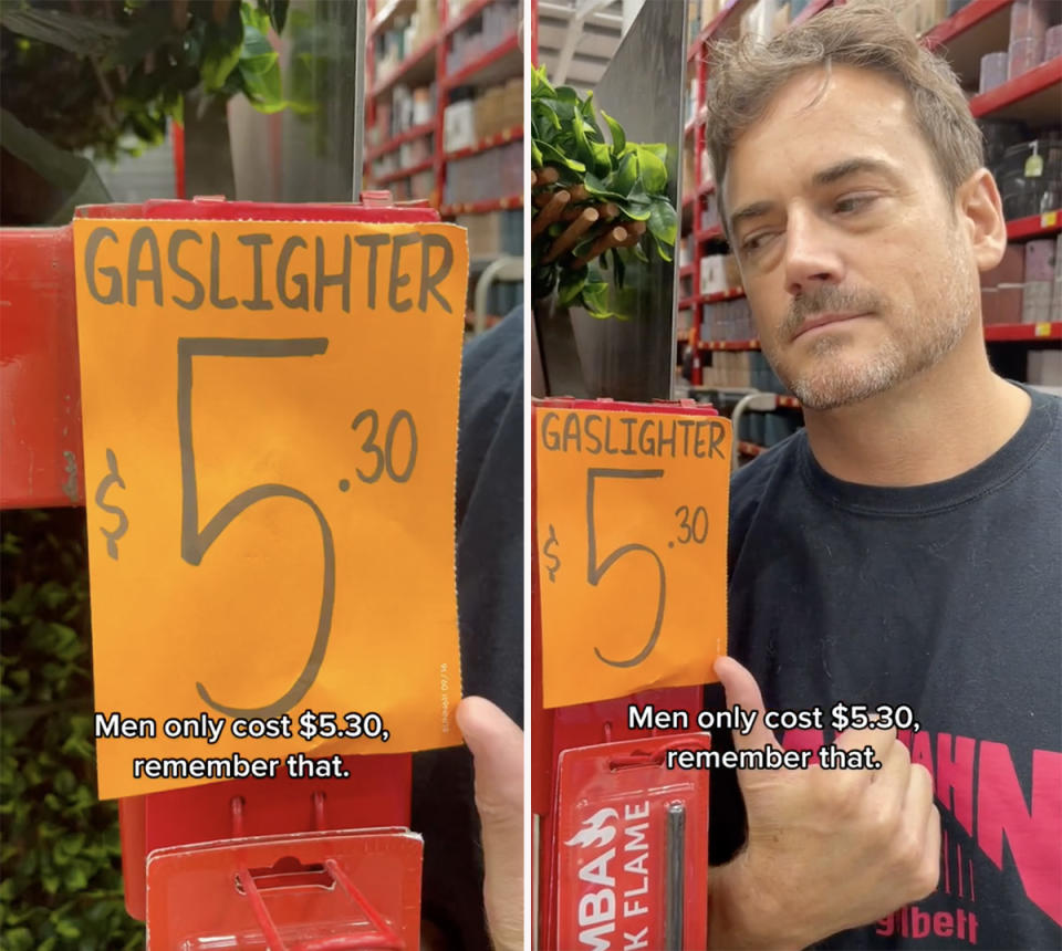 Man standing next to gaslighter sign