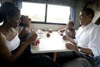 <p>Playing cards in their RV on a campaign swing between Oskaloosa and Pella, Iowa [Photo: Charles Ommanney/Getty] </p>