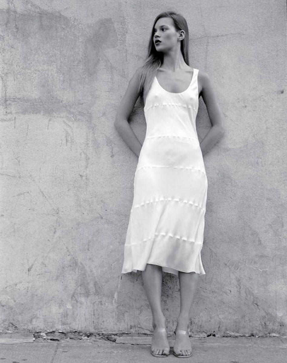 Calvin Klein's bias-cut seamed slipdress modeled by muse Kate Moss was at the heart of his 1994 resort collection advance. Photographed in New York City on August 8, 1994. 