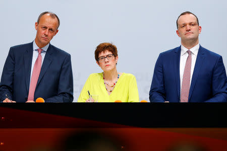 Christian Democratic Union (CDU) candidates for the party chair Friedrich Merz, Annegret Kramp-Karrenbauer and Jens Spahn attend a regional conference in Duesseldorf, Germany, November 28, 2018. REUTERS/Thilo Schmuelgen/Files