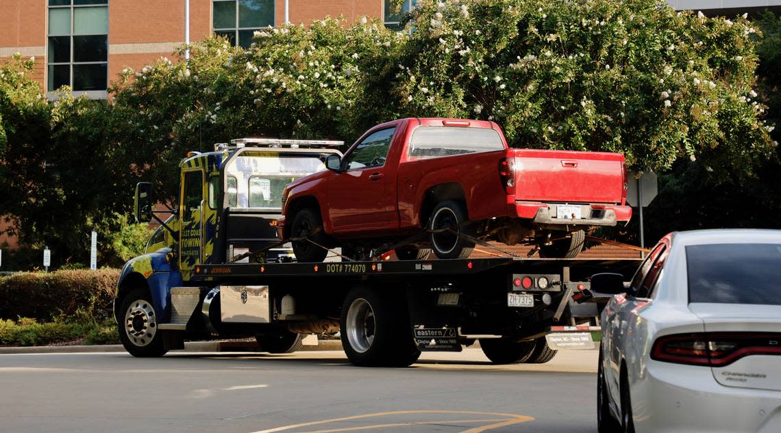 A red pickup truck is transported to the Wake County Detention Center/City-County Bureau of Identification in Raleigh, N.C., Wednesday, August 17, 2022.