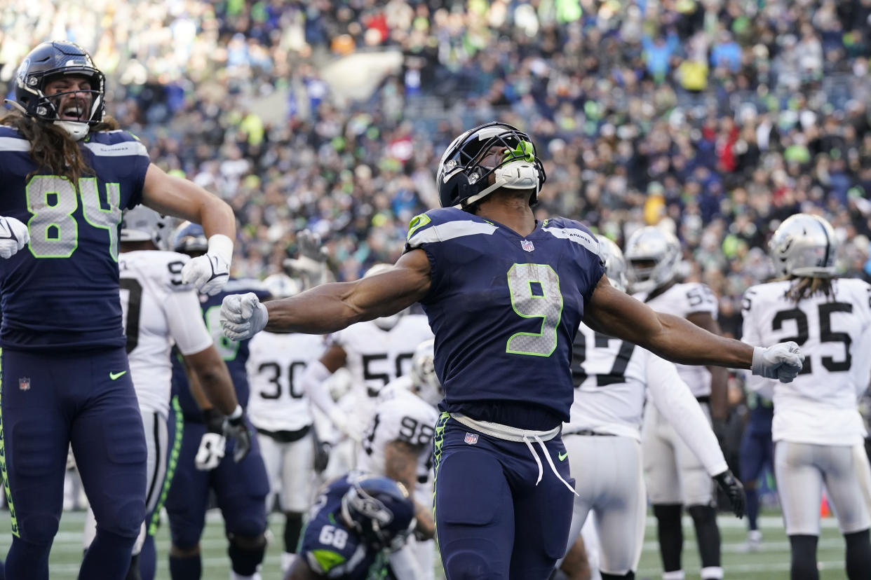 Seattle Seahawks running back Kenneth Walker III (9) celebrates his rushing touchdown against the Las Vegas Raiders during the second half of an NFL football game Sunday, Nov. 27, 2022, in Seattle. (AP Photo/Gregory Bull)