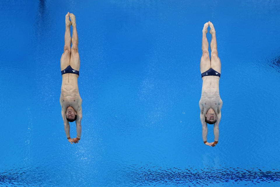 FILE - In this July 26, 2021, file photo, gold medal winners Britain's Thomas Daley and Matty Lee compete in the synchronized 10-meter platform diving final at the 2020 Summer Olympics, in Tokyo. The Tokyo Games are shaping up as a watershed for LGBTQ Olympians. Daley announced in 2013 that he was dating a man and “couldn't be happier,” his coming out was an act of courage that, with its rarity, also exposed how the top echelons of sport weren't seen as a safe space by the vast majority of LGBTQ athletes. (AP Photo/David J. Phillip, File)