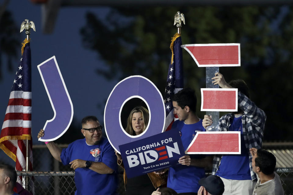 Supporters hold a sign before a campaign rally for Democratic presidential candidate former Vice President Joe Biden on Tuesday, March 3, 2020, in Los Angeles. (AP Photo/Marcio Jose Sanchez)