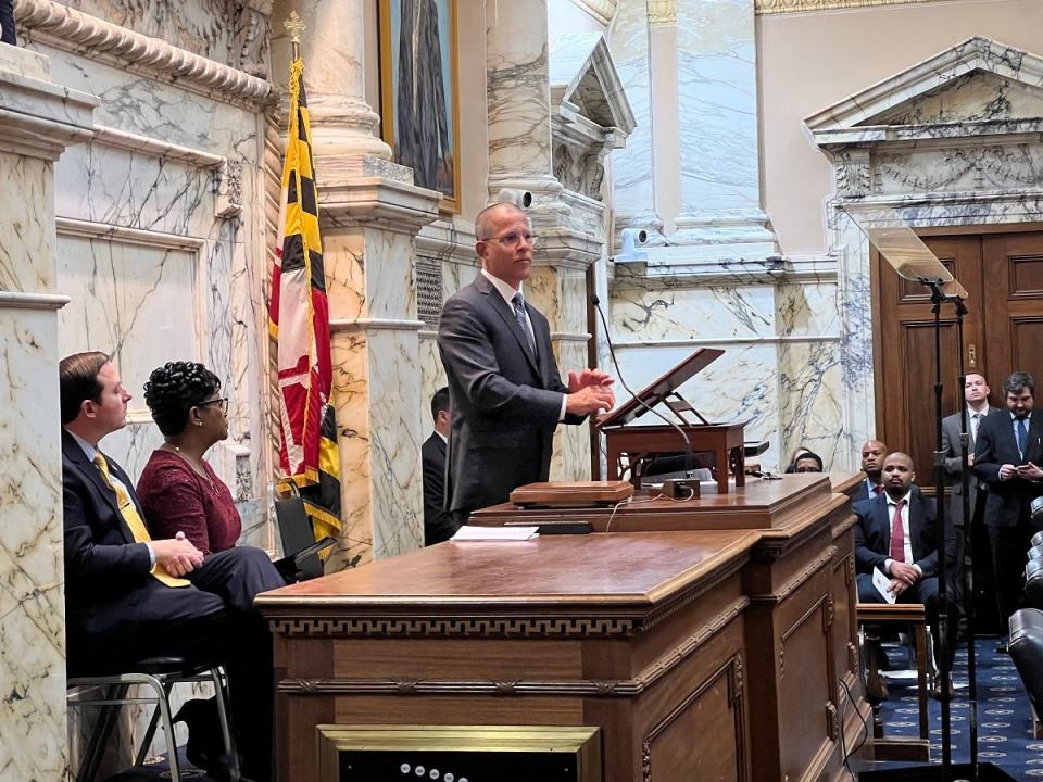 Maryland's Attorney General Anthony Brown stands in the House Chamber at the State House in Annapolis, Maryland on Jan. 3, 2023. Senate President Bill Ferguson (left), House Speaker Adrienne Jones (second from left), and Governor-Elect Wes Moore (seated near doors) look on as Brown became the state's first African American Attorney General.