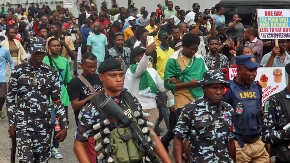 Members of the security forces escort protesters during a demonstration against the cost of living crisis the country is going through, in Lagos, Nigeria - August 1, 202