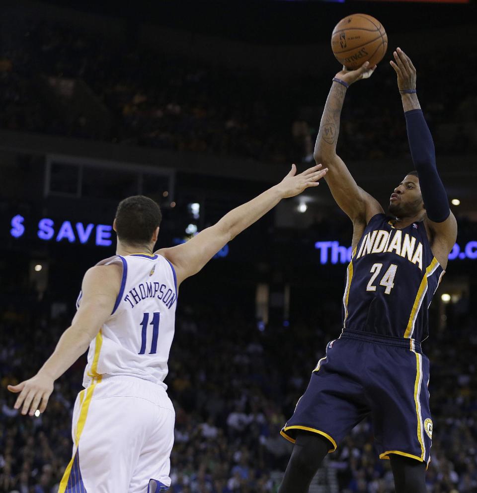 Indiana Pacers' Paul George (24) shoots over Golden State Warriors' Klay Thompson during the second half of an NBA basketball game Monday, Jan. 20, 2014, in Oakland, Calif. (AP Photo/Ben Margot)