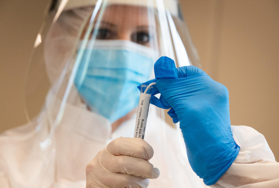 A health worker collect a sample of the COVID-19 coronavirus infections taken from Residence Dejaifve retirement home residents and workers, in Fosses La Ville, Belgium, on April 29, 2020. The government has announced a phased plan to attempt an exit from the lockdown situation in the country, continuing to avoid the spread of Covid-19. (Photo by BENOIT DOPPAGNE / BELGA / AFP) / Belgium OUT (Photo by BENOIT DOPPAGNE/BELGA/AFP via Getty Images)