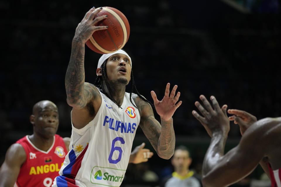 Philippines guard Jordan Clarkson (6) shoots during their Basketball World Cup group A match against Angola at the Araneta Coliseum in Manila, Philippines Sunday, Aug. 27, 2023. (AP Photo/Aaron Favila)