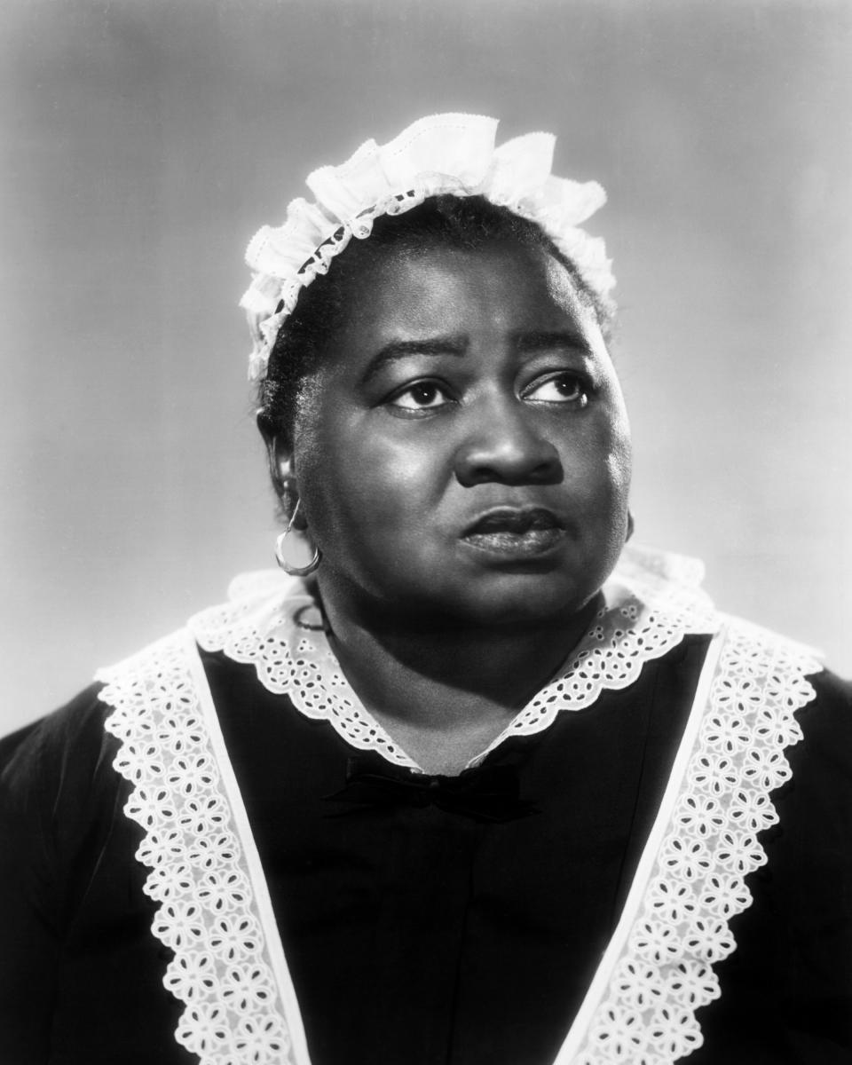 American actress Hattie McDaniel (1895 - 1952) in a maid's uniform, circa 1935. McDaniel won an Oscar for Best Supporting Actress for her role of Mammy in 'Gone With The Wind', making her the first African-American to win an Academy Award. (Photo by Silver Screen Collection/Getty Images)