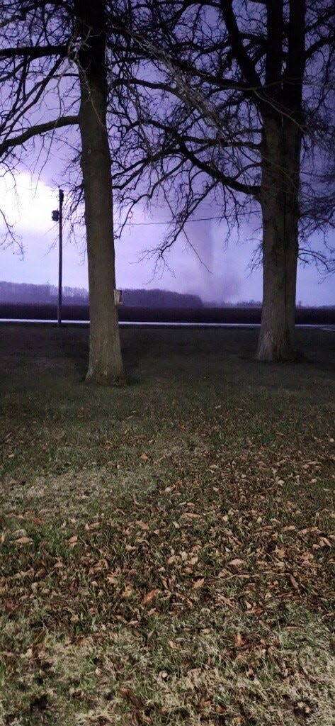 An eastbound funnel cloud is visible shortly after 8 p.m.Thursday from a home two miles north of Ind. 32 and three miles west of Winchester in Randolph County. The storm a short time later did massive damage in Winchester, hitting a mobile home park and other properties and leaving at least three people dead.