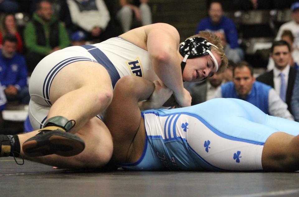 Hartland heavyweight Vincent Cox got his third pin of the team finals against Detroit Catholic Central's Benny Ezuika during the state Division 1 championship dual Saturday, Feb. 25, 2023 at Wings Event Center.