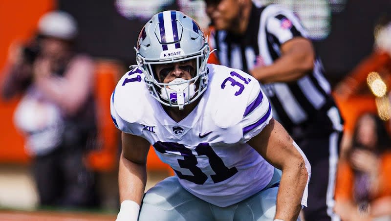 Kansas State linebacker Jake Clifton prepares for a play during the 2023 season. After two seasons with the Wildcats, Clifton announced that he will take a pause from college football to serve a Latter-day Saint mission.