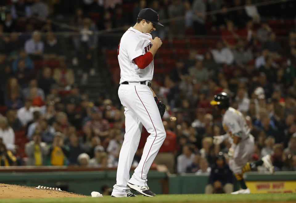 Red Sox reliever Carson Smith suffered a potentially “major injury” when he threw his glove in frustration after giving up a home run. (AP)