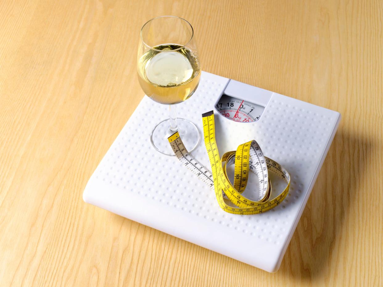 Wine, alcohol, tape measure on a scale weight loss