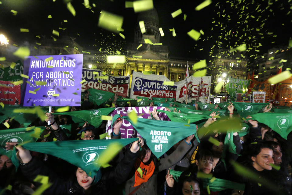 In this June 26, 2018 photo, women stage a demonstration in favor of a measure to expand legal abortions, in Buenos Aires, Argentina. More than 60 percent of Argentinians - especially young people - are in favor of legalizing abortion, according to a poll by the social sciences faculty of the University of Buenos Aires. (AP Photo/Jorge Saenz)