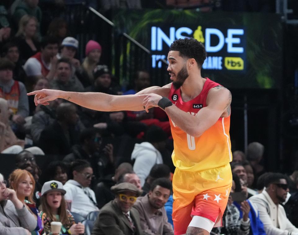 Team Giannis forward Jayson Tatum celebrates a three-point shot against Team LeBron.