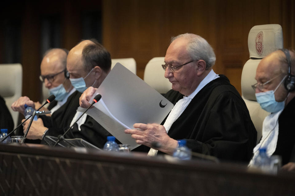 Judge and vice president Kirill Gevorgian of Russia, second right, starts reading the verdict of The International Court of Justice, the United Nations' top court, which issued its judgment in a dispute between Iran and the United States over frozen Iranian state bank accounts worth some $2 billion, in The Hague, Netherlands, Thursday, March 30, 2023. (AP Photo/Peter Dejong)