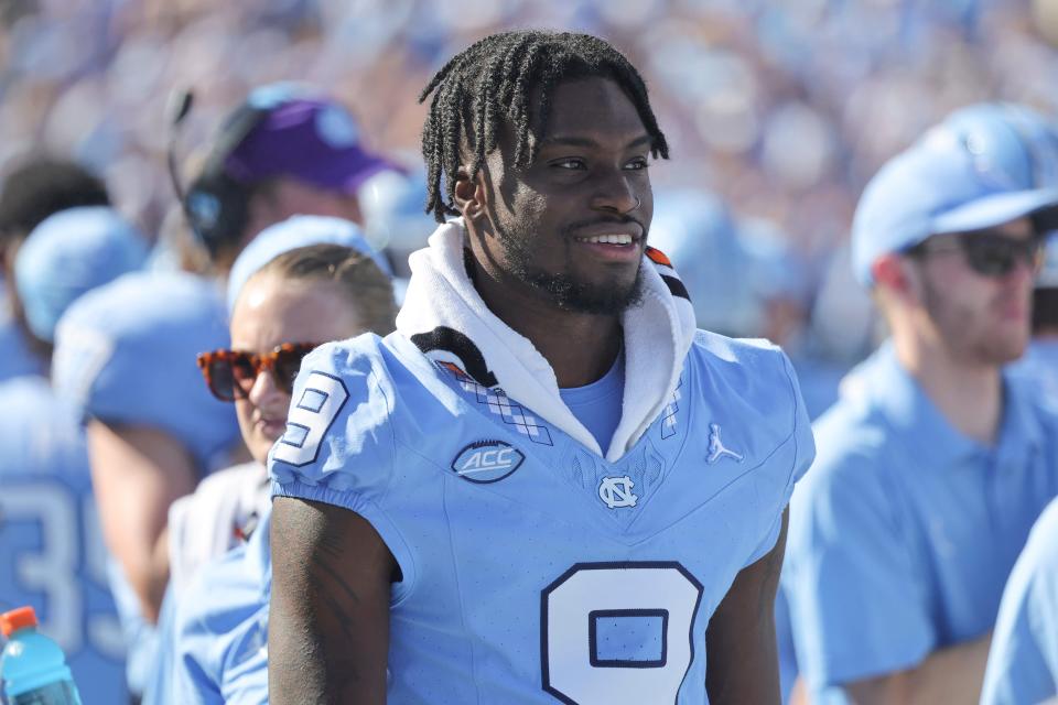 North Carolina wide receiver Devontez Walker (9) watches the game from the bench during the second quarter against Minnesota.