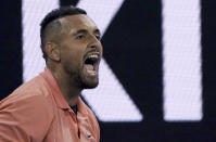 Australia's Nick Kyrgios reacts during his second round singles match against France's Gilles Simon at the Australian Open tennis championship in Melbourne, Australia, Thursday, Jan. 23, 2020. (AP Photo/Lee Jin-man)