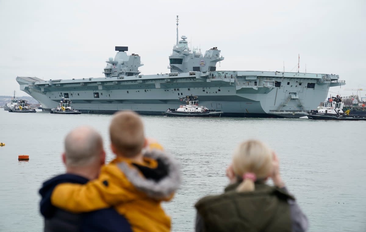A Royal Navy aircraft carrier returns to her home port of Portsmouth  (Andrew Matthews/PA Wire)