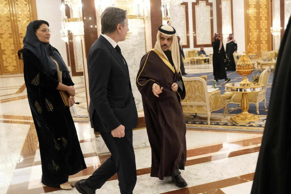 US Secretary of State Antony Blinken is greeted by Saudi Arabia's Foreign Minister Prince Faisal bin Farhan Al-Saud, right, and Saudi Arabia's Ambassador to the US, Princess Reema bint Bandar Al Saud in Riyadh, Saudi Arabia, Monday, Feb. 5, 2024. (AP Photo/Mark Schiefelbein, Pool)