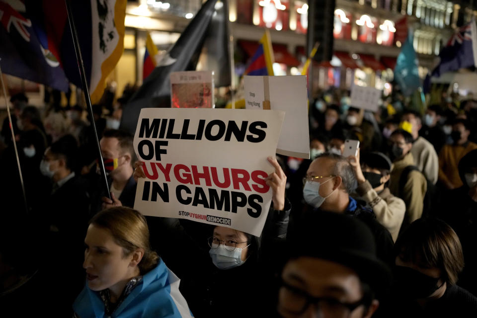 FILE - Demonstrators supporting Tibetans, Uyghurs and Hong Kongers take part in a protest against the Chinese Communist Party (CCP) to coincide with the 72nd National Day of the People's Republic of China, as they march along Regent Street towards the Chinese Embassy, in London, on Oct. 1, 2021. The U.S. Holocaust Memorial Museum says it has compiled evidence of increasing government repression against Uyghur Muslims in China's western Xinjiang region (AP Photo/Matt Dunham, File)