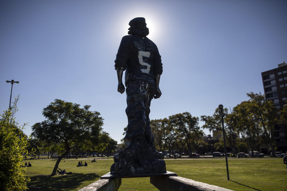 A statue of Cuba's revolutionary hero, Ernesto "Che" Guevara, stands in his birth city of Rosario, Argentina, Friday, April 30, 2021. Rosario is best known as a major agricultural port, the birthplace of revolutionary leader Ernesto “Che” Guevara and a talent factory for soccer players, including Lionel Messi. (AP Photo/Rodrigo Abd)