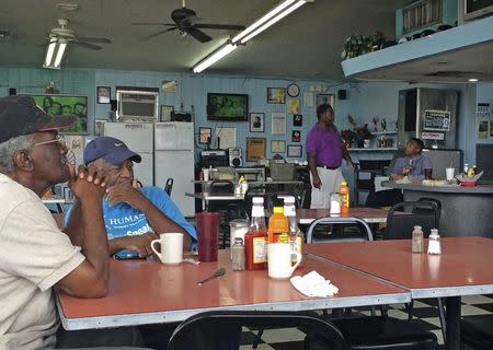 Lawrence Drayton (L), 77, and Willie J. White, 74, talk at Jumbo's Restaurant located in Miami's Liberty City area, in this picture taken July 22, 2014. REUTERS/Zachary Fagenson