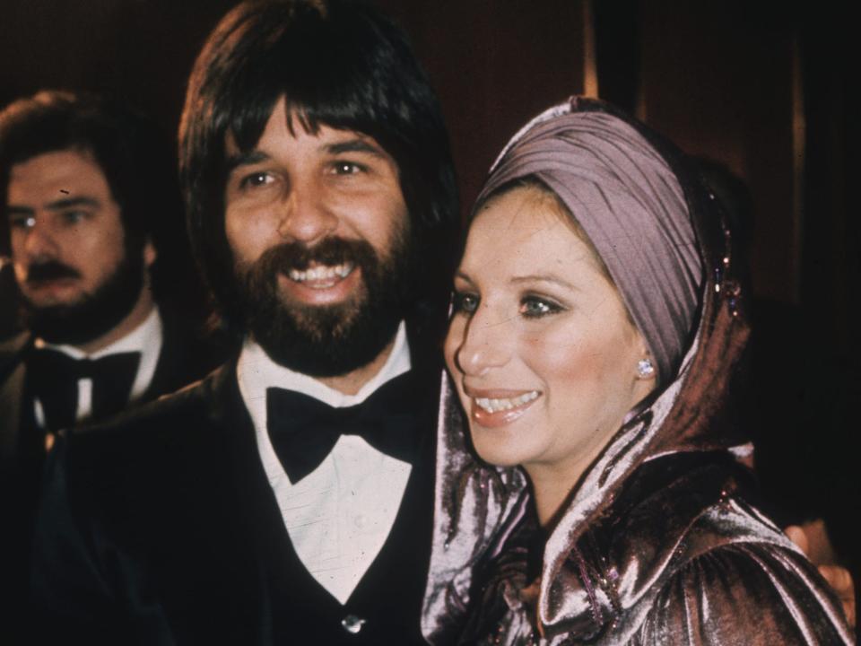 Jon Peters in a tuxedo and Barbara Streisand in a dress