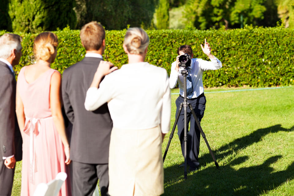 A wedding party posing for photos