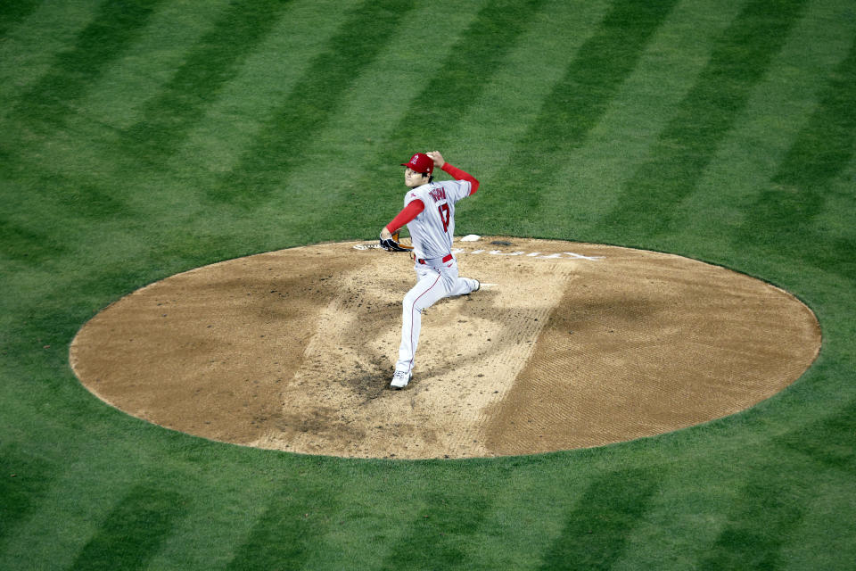 Los Angeles Angels' Shohei Ohtani throws against the Oakland Athletics in the fifth inning of an opening day baseball game in Oakland, Calif., Thursday, March 30, 2023. (AP Photo/Jed Jacobsohn)