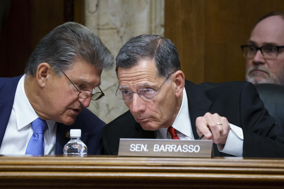 FILE - In this June 23, 2021, file photo, Sen. Joe Manchin, D-W.Va., chair of the Senate Energy and Natural Resources Committee holds a hearing with Ranking Member Sen. John Barrasso, R-Wyo., right, at the Capitol in Washington. A former federal law enforcement officer is alleging that President Joe Biden's pick to oversee federal lands in western states stonewalled a 1989 investigation into the sabotage of an Idaho timber sale. The allegation against U.S. Bureau of Land Management nominee Tracy Stone-Manning was made in a letter from a retired investigator released Thursday, July 15, 2021, by Sen. Barrasso. (AP Photo/J. Scott Applewhite, File)