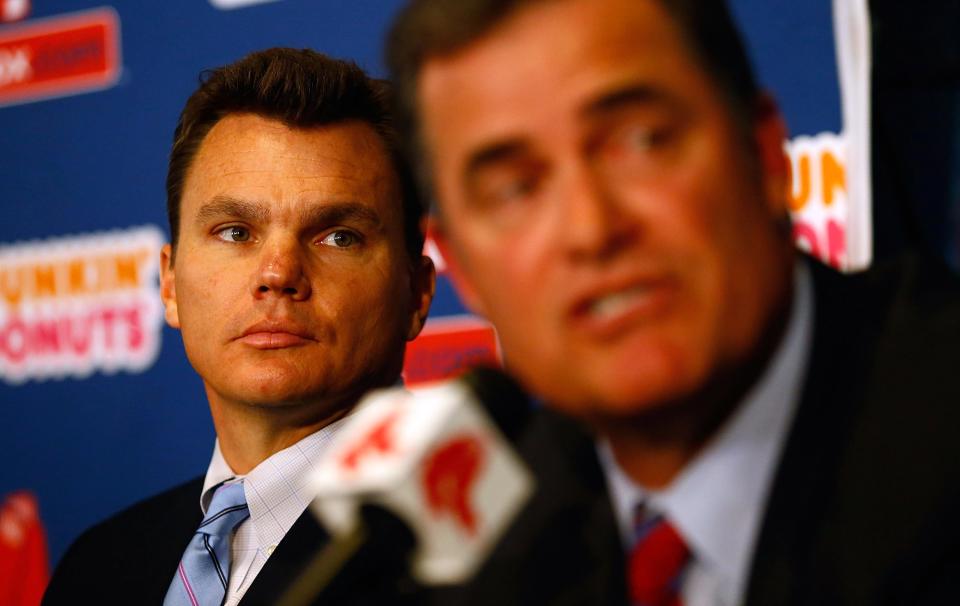 BOSTON, MA - OCTOBER 23: Executive Vice President and General Manager of the Boston Red Sox, Ben Cherington (L), listens after introducing John Farrell as the new manager, the 46th manager in the club's 112-year history, on October 23, 2012 at Fenway Park in Boston, Massachusetts. (Photo by Jared Wickerham/Getty Images)