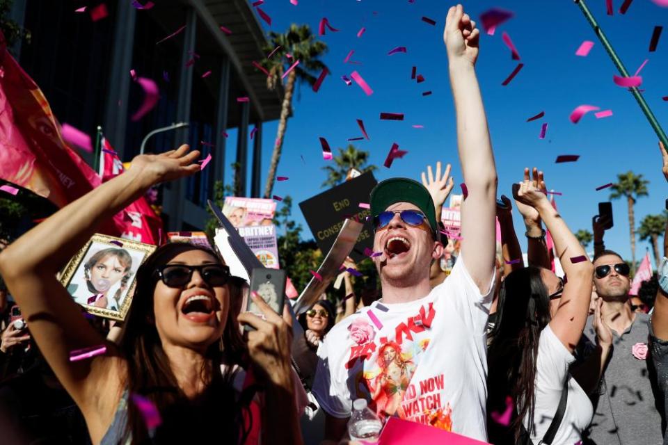 Confetti falls as people cheer upon hearing that Spears’s conservatorship has been terminated.