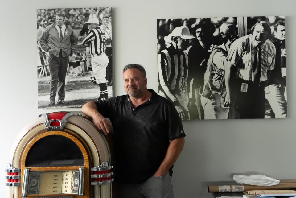 John Madden's son, Joe, is surrounded by his father's memorabilia at Goal Line Studios in Pleasanton, California.