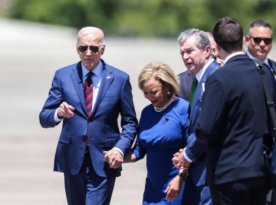 President Joe Biden arrives at North Carolina Air National Guard in Charlotte to meet with families of slain officers on Thursday, May 2, 2024. To the right is Charlotte Mayor Vi Lyles and Gov. Roy Cooper.