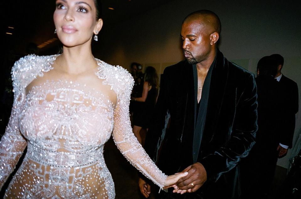 Kim Kardashian West (wearing intricately embroidered Roberto Cavalli) and Kanye West at the 2015 Met gala.