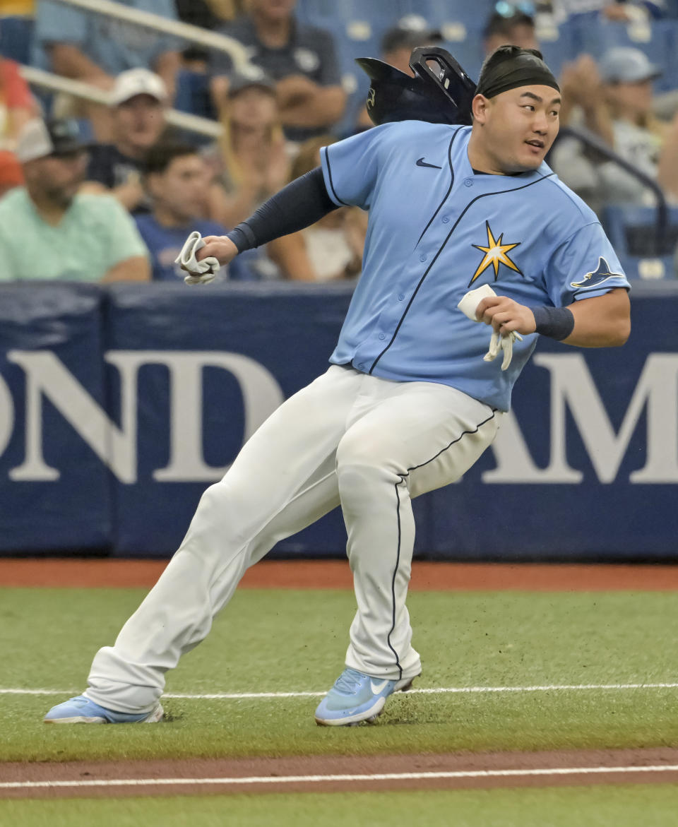 Tampa Bay Rays' Ji-Man Choi stops short as he rounds third base on a single hit by Josh Lowe during the third inning of a baseball game against the Pittsburgh Pirates, Sunday, June 26, 2022, in St. Petersburg, Fla. (AP Photo/Steve Nesius)