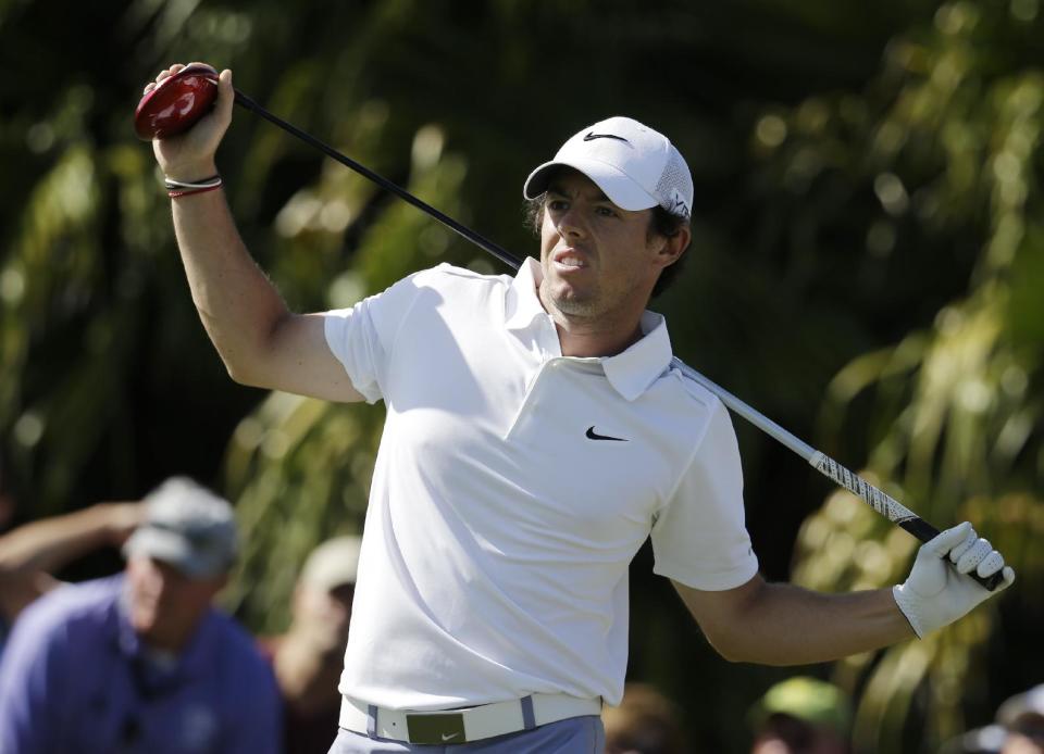 Rory McIlroy of Northern Ireland watches as his shot off the eighth tee goes into the fairway rough during the second round of the Cadillac Championship golf tournament Friday, March 7, 2014, in Doral, Fla. (AP Photo/Lynne Sladky)