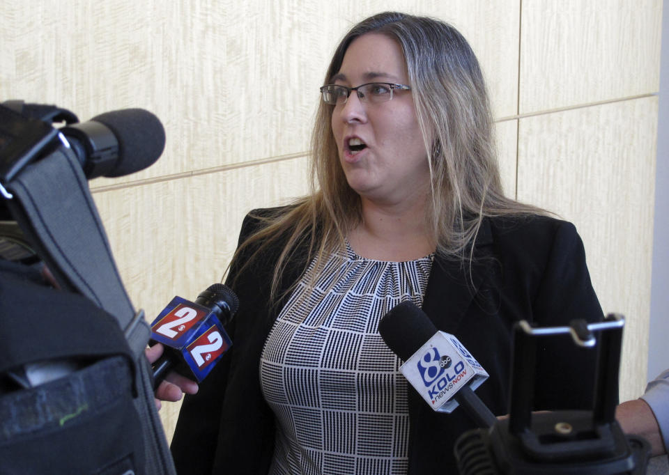 Carson City Deputy District Attorney Melanie Brantingham talks to reporters Friday, Feb. 8, 2019, outside Carson City Justice Court in Carson City, Neb., after a brief court appearance by a 20-year-old Salvadoran accused of murdering four people. Wilber Martinez-Guzman agreed to postpone his preliminary hearing on related burglary charges in Carson City and be extradited to Reno to face four murder counts in Washoe County first. (AP Photo/Scott Sonner)